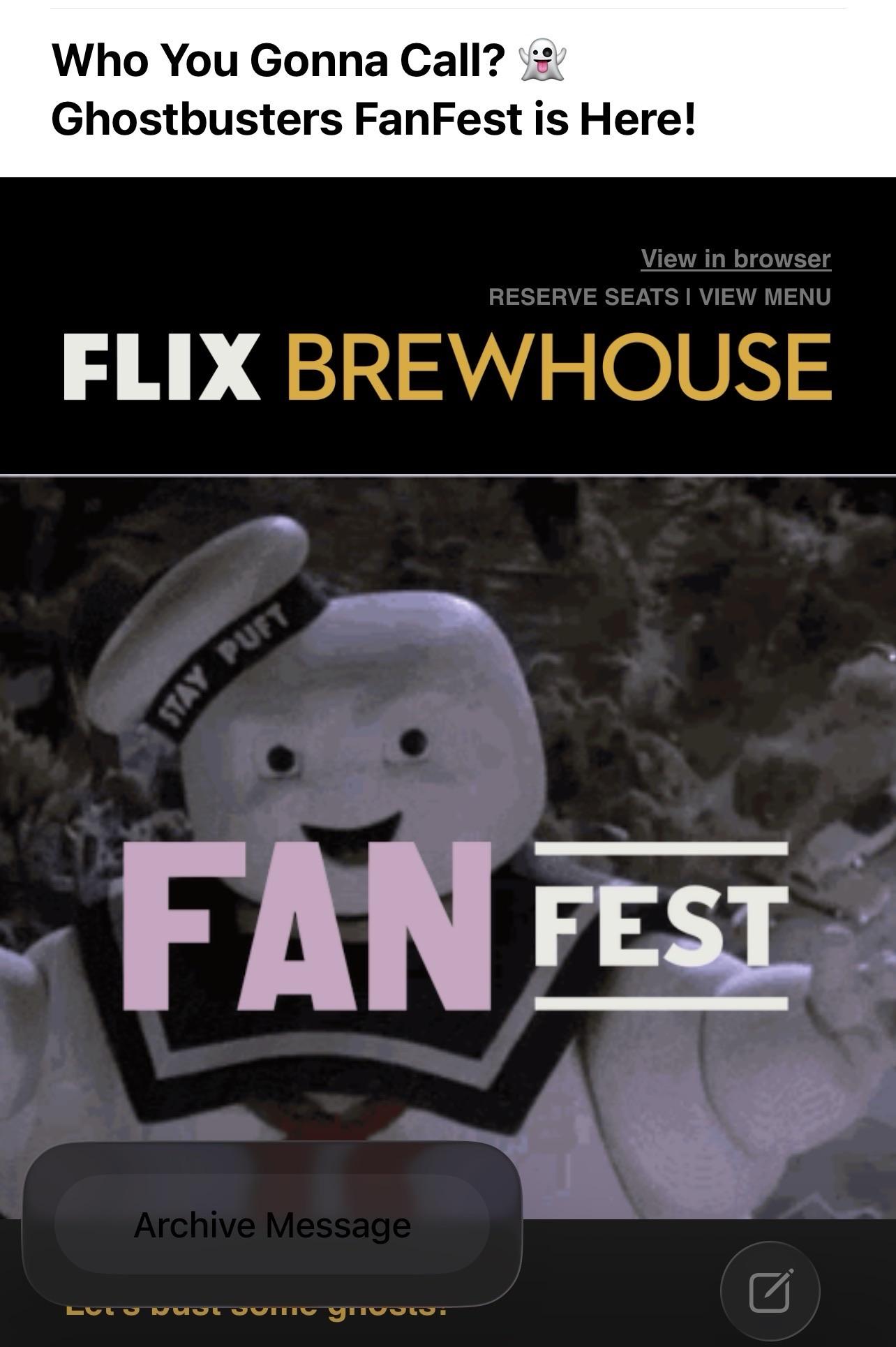 Flix Brewhouse newsletter in Apple’s Mail app in iOS 26. The background of the newsletter is black. The Archive button is in the foreground and the Liquid Glass overlay takes on the black background, but the text in the button also stays black, making it nearly impossible to read.